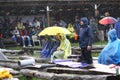 11 JULY 2013 - GARANA, ROMANIA. Scenes and people sitting or walking on the street in a rainy day Royalty Free Stock Photo