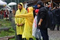 11 JULY 2013 - GARANA, ROMANIA. Scenes and people sitting or walking on the street in a rainy day Royalty Free Stock Photo