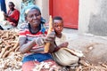 16 July 2019 - Kisumu, Rwanda : A woman peeling a cassava root in northern Rwanda