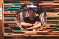 Young man reading a book in the Last Book Store in LA. Royalty Free Stock Photo