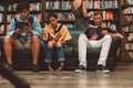 Young man reading a book in the Last Book Store in LA. Royalty Free Stock Photo