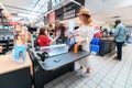 People standing in line to the cashier in Auchan supermarket