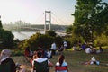 15 July Martyrs Bridge and people having picnic in Nakkastepe Nation`s Garden. Editorial shot in Istanbul Turkey