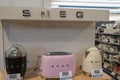July 2021 Milan, Italy: Smeg kitchen appliances on the store shelf close-up. Smeg logo icon