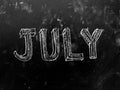 July Month Handwritten on Blackboard