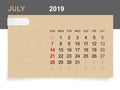 July 2019 - Monthly calendar on brown paper and wood background.
