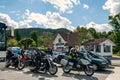 July 31, 2013: Norway, group of bikers travels on bikes. Bikers waiting for a ferry on the shore of the fjord on a sunny