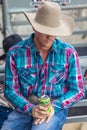 JULY 22, 2017 NORWOOD COLORADO - cowboy in plad shirt watches San Miguel Basin Rodeo, San Miguel. Cowboy, Action Royalty Free Stock Photo