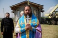 July 11, 2020, Russia, Magnitogorsk. An Orthodox priest conducts a prayer ceremony next to a small church under construction.