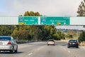 July 4, 2019 San Bruno / CA / USA - Travelling on the freeway in San Francisco bay area; signs signalling approaching interchange