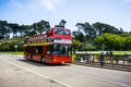 July 20, 2018 San Francisco / CA / USA - Hop on Hop off Double Decker city tour bus taking tourists through Golden Gate Park Royalty Free Stock Photo