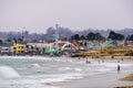 July 1, 2018 Santa Cruz / CA / USA - The Crowds having fun on the beach and at the Santa Cruz boardwalk on a foggy day