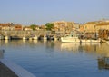 July 2022 Senigallia, Italy: Boats in the port during sunrise. Senigallia marina across buildings. Canal in Senigallia