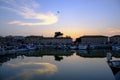 July 2022 Senigallia, Italy: view of the harbor on the sunset over the yachts and boats. Urban view. City postcard