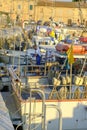 July 2022 Senigallia, Italy: Workers on the ship. Boats in the port. Sailors in work progress Royalty Free Stock Photo