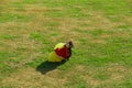 31 July 2022 Skutec, Czech Republic. Landing of a parachutist, a parachutist goes to fold a parachute.