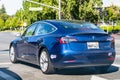 July 9, 2020 Sunnyvale / CA / USA - Tesla Model 3 waiting at a traffic light in Silicon Valley