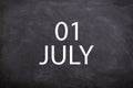 01 July text with blackboard background for calendar.