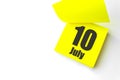 July 10th. Day 10 of month, Calendar date. Close-Up Blank Yellow paper reminder sticky note on White Background. Summer month, day Royalty Free Stock Photo