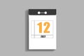 july 12. 12th day of month, calendar date.White page of tear-off calendar, on gray insulated wall. Concept of day of