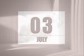 july 03. 03th day of the month, calendar date.White sheet of paper with numbers on minimalistic pink background with