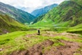 July 14th 2022, Himachal Pradesh India. A man with a walking stick trekking down to Parvati bagh valley during Shrikhand Mahadev Royalty Free Stock Photo