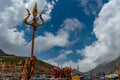 . Religious red cloths (chunri) and tridents (trishul), symbols of Lord Shiva, against Kailash Parvat