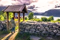 July 23, 2015: Traveller at the entrance to Urnes Stave Church, Royalty Free Stock Photo