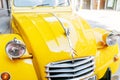 Yellow Citroen retro car on city street