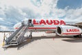 Lauda commercial airplane waiting for boarding passengers in Schwechat airport Royalty Free Stock Photo