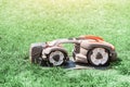Robot automatic lawn mower working on a grass