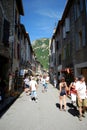 A pretty street busy with tourists in the pretty walled town of Villfranche de Conflent in the south of France. This medieval city