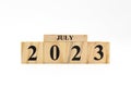 July 2023 written on wooden blocks isolated on white background with copy space Royalty Free Stock Photo