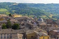 A jumble of roof tops rise above the surrounding countryside in Orvieto, Italy