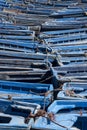 jumble of small blue fishing bats huddled together in port