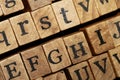 Jumbled up block wood print letters lined up Royalty Free Stock Photo