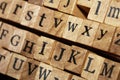 Jumbled up block wood print letters lined up Royalty Free Stock Photo