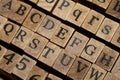 Jumbled up block wood print letters lined up Royalty Free Stock Photo