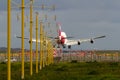 Jumbo jet airliner landing at airport Royalty Free Stock Photo