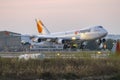 Jumbo Jet landing in low light after sunset Royalty Free Stock Photo