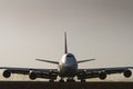 Jumbo jet in silhouette on airport runway