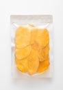 Jumbo pack of dried large sweet mango slices on white background