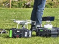 Mature male technicians using professional drone to record tv show