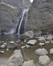 Jump Creek Falls waterfall, Marsing, Idaho in the Owyhee Mountains, right distant portrait Royalty Free Stock Photo