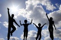 Jump family of four on sky Royalty Free Stock Photo