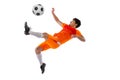 Professional football, soccer player in motion isolated on white studio background. Concept of sport, match, active