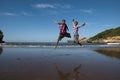 Jump fun at the beach Royalty Free Stock Photo