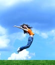 Jump girl over a grass Royalty Free Stock Photo