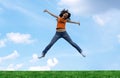Jump girl over a grass Royalty Free Stock Photo