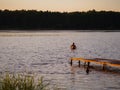 Jump the guy into the river at sunset